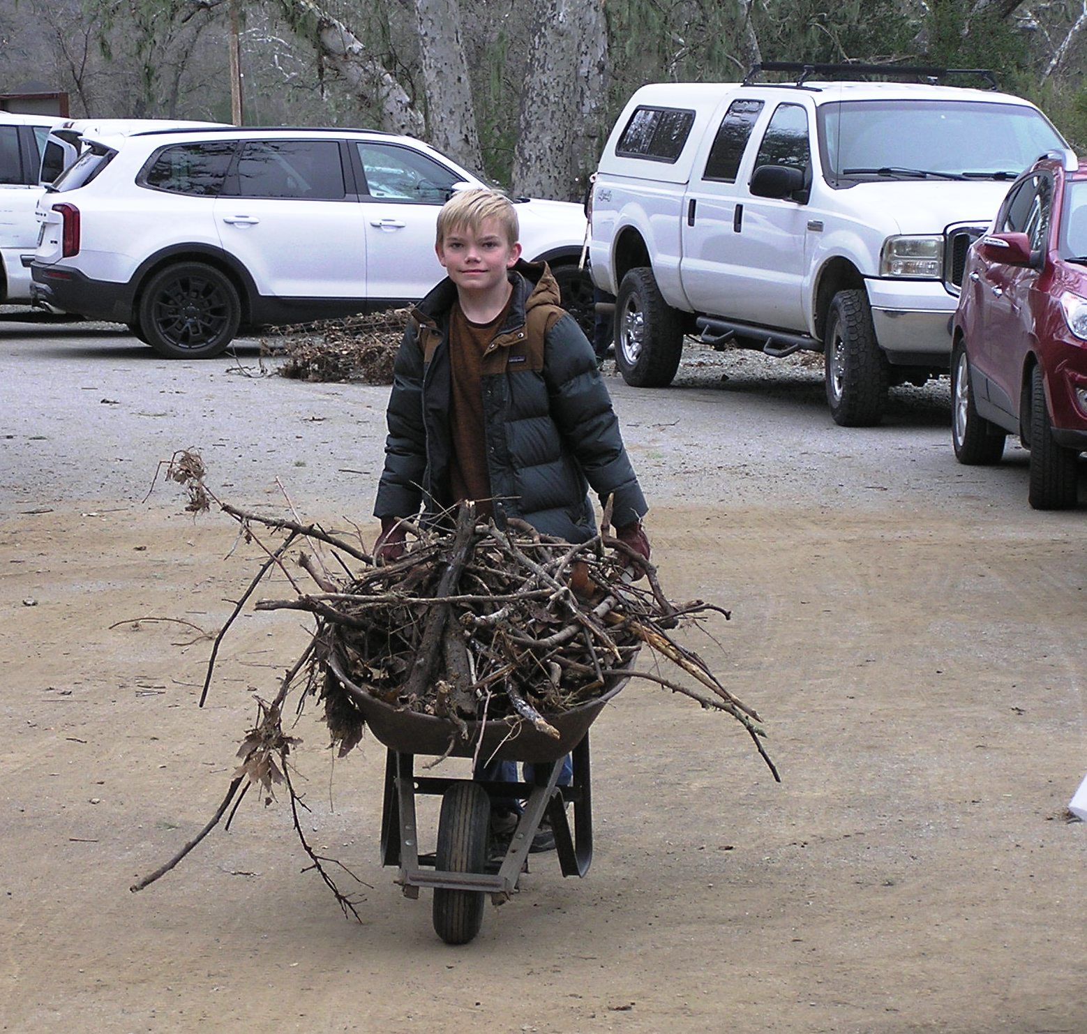 Wheeling debris from the fence along the Horse Trailer parking area.